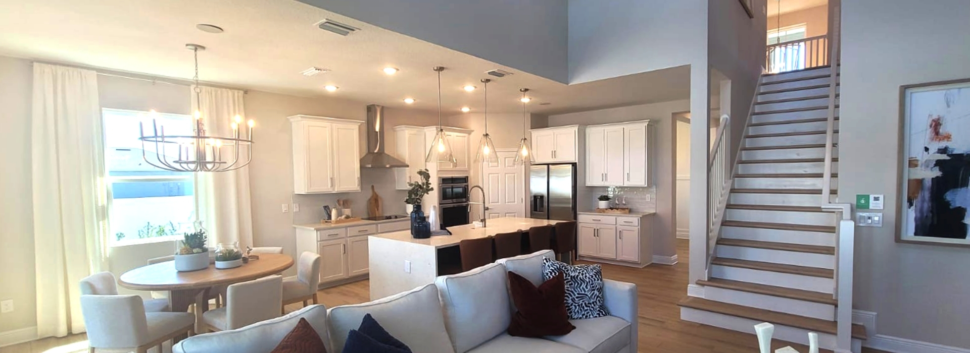 Elegant White Kitchen with Island and Open Concept Design
