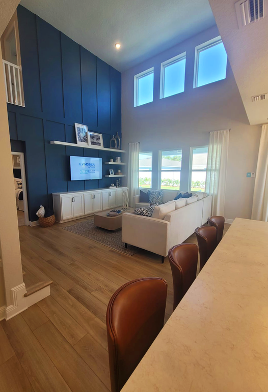 Dramatic Living Room with Navy Blue Accent Wall and Built-in Entertainment Center